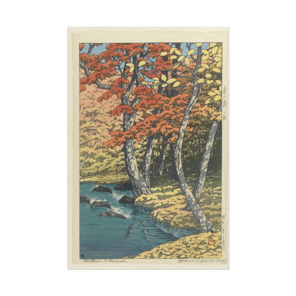 Autumn landscape with vibrant trees and a peaceful stream