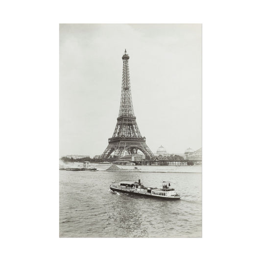 Black and white print of the Eiffel Tower beside the Seine River.