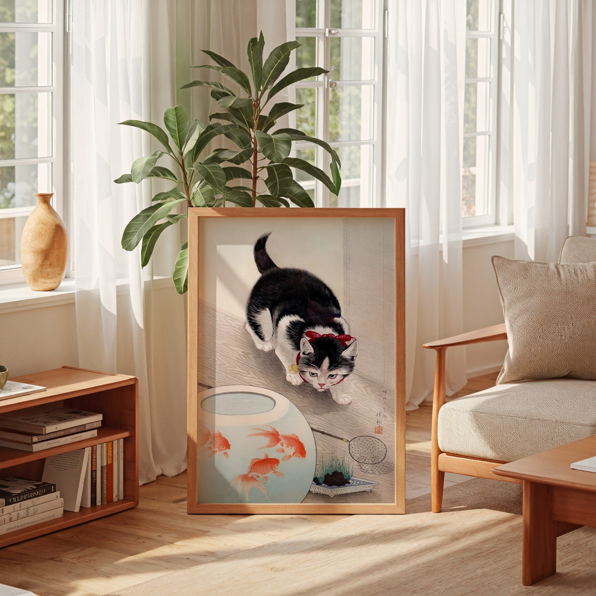Cat and Goldfish woodblock print by Ohara Koson framed on a wall