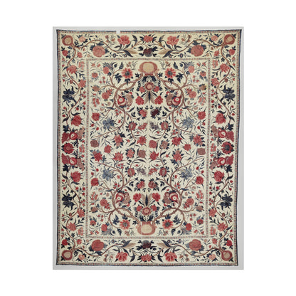 Intricate vintage floral textile design with red and blue flowers.