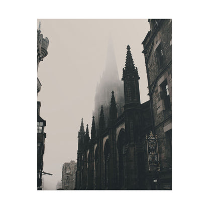 Misty view of a Gothic cathedral in Edinburgh with spires.