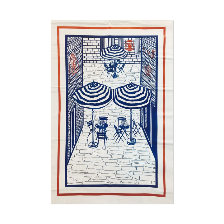 Line drawing of a French café scene with umbrellas and seating.