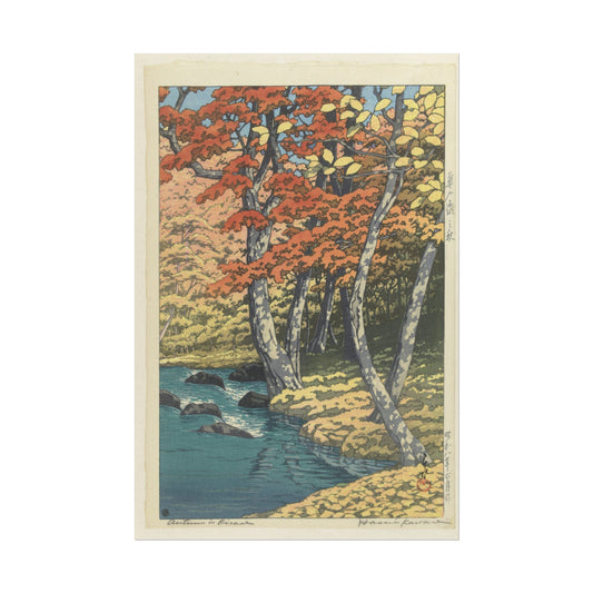Autumn landscape with vibrant trees and a peaceful stream