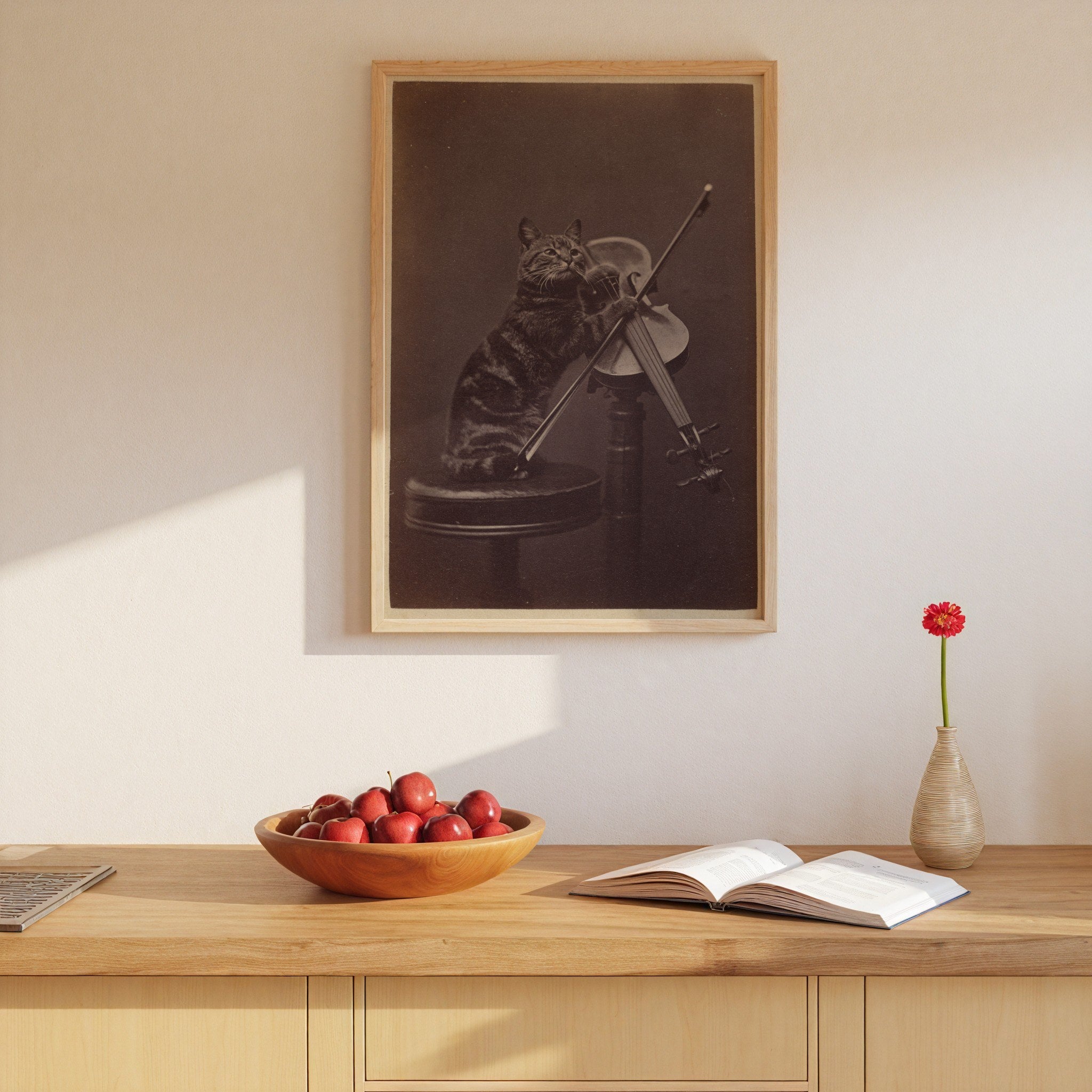 Cat Playing Violin vintage photograph framed on a wall