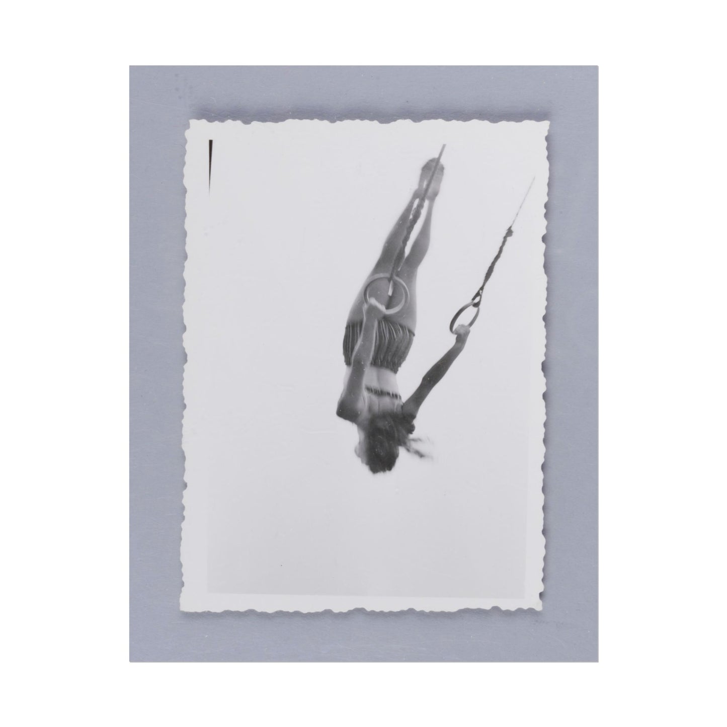 Woman Swinging on Rings