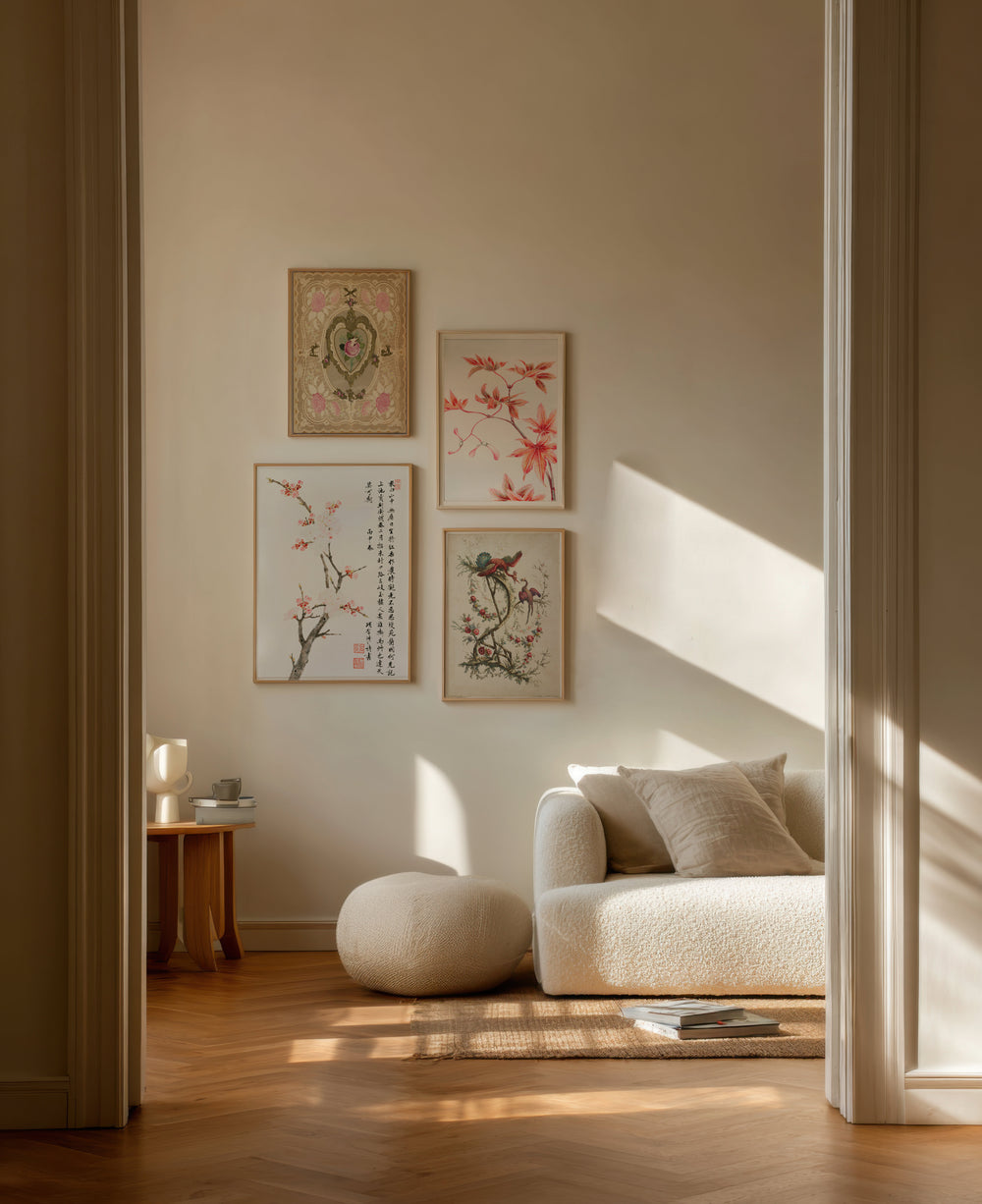 Living room with a beige sofa, ottoman, and wall art